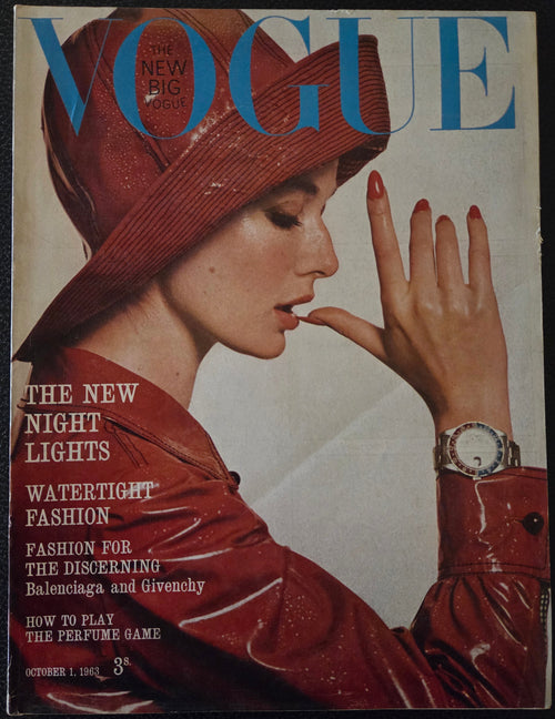 Vintage vogue with a model in a red raincoat and hat.