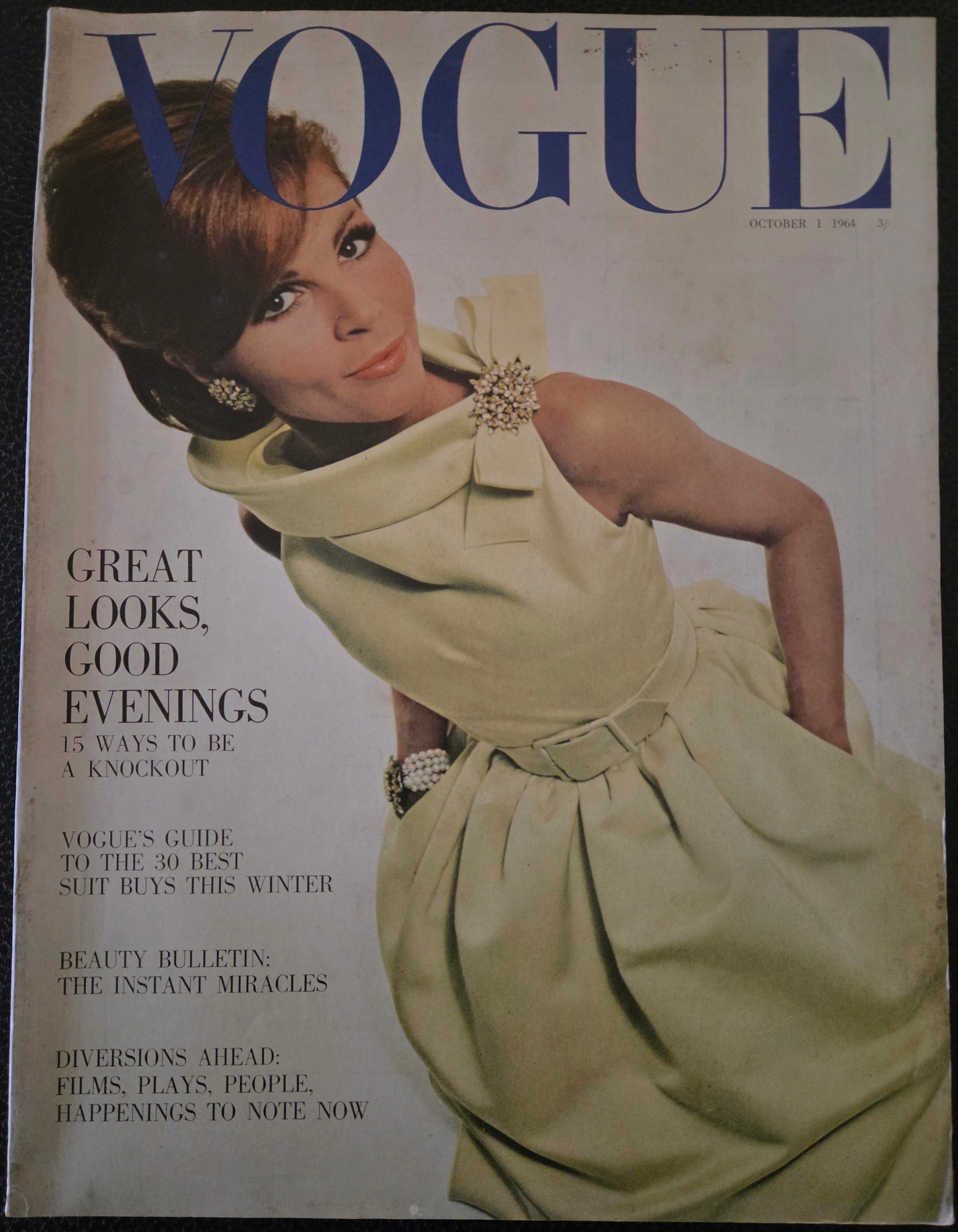 Vogue magazine cover with a model in a dress