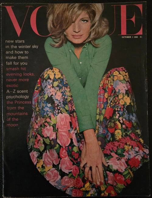 Vintage magazine cover with a woman wearing a floral skirt and green shirt.
