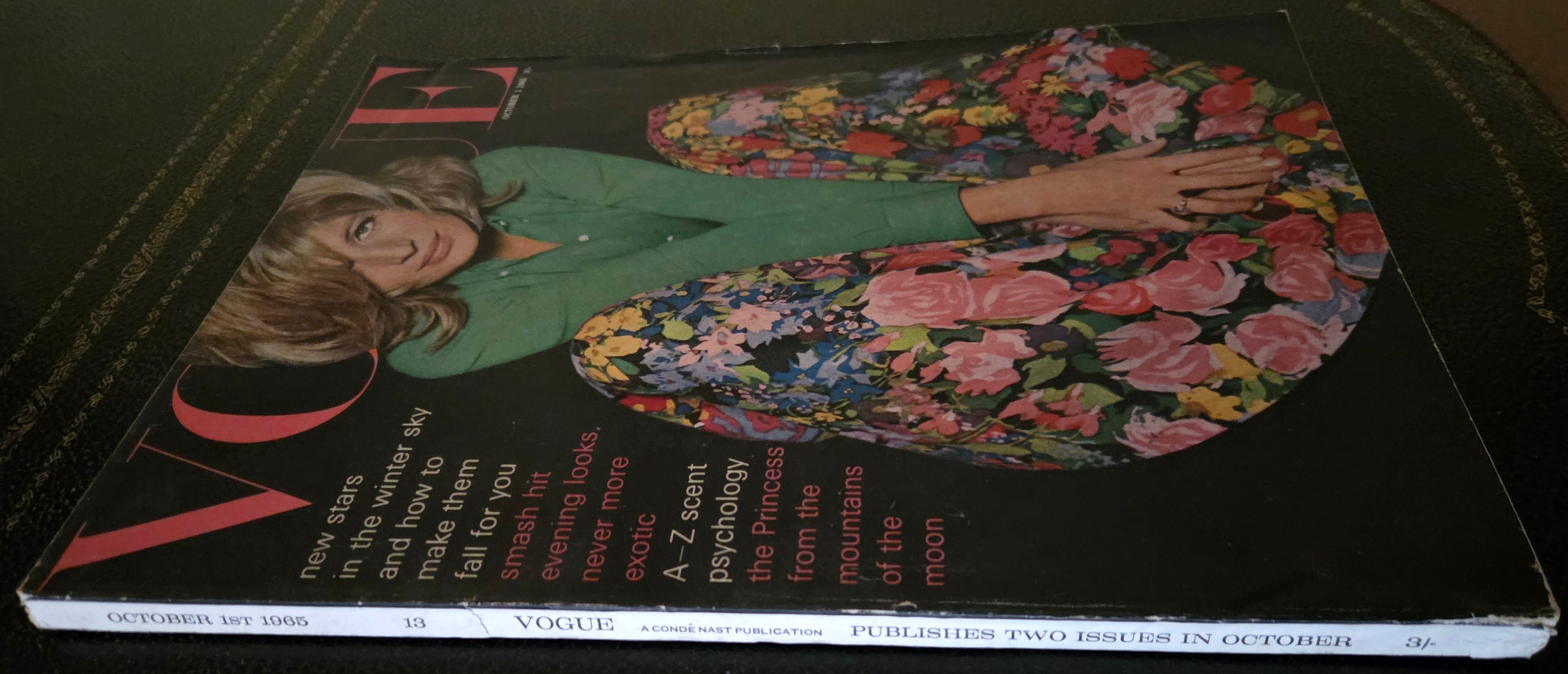 Vintage vogue with model in green skirt and floral skirt.