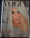 Vintage Vogue magazine cover with a woman's face and text