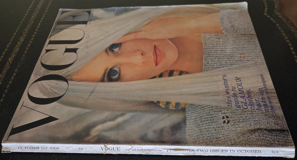 Vogue with model wearing grey jumper.