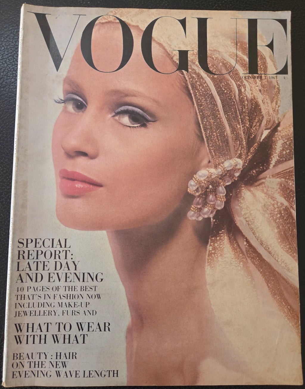 Vogue magazine cover with a woman's face and text