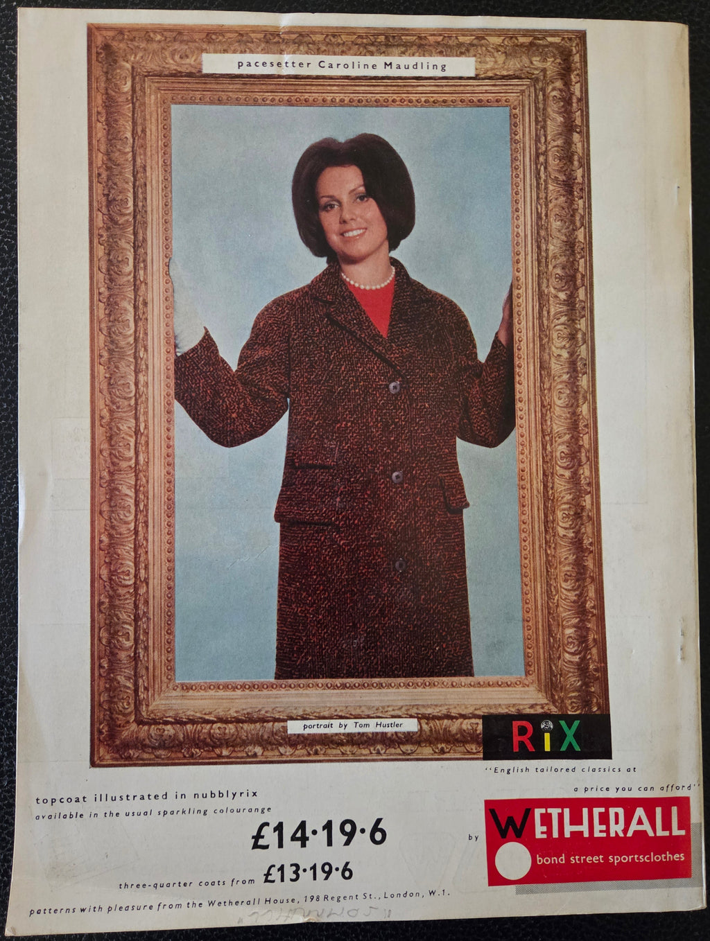 Vintage advert of a person in a coat with a decorative frame advertising Wetherall
