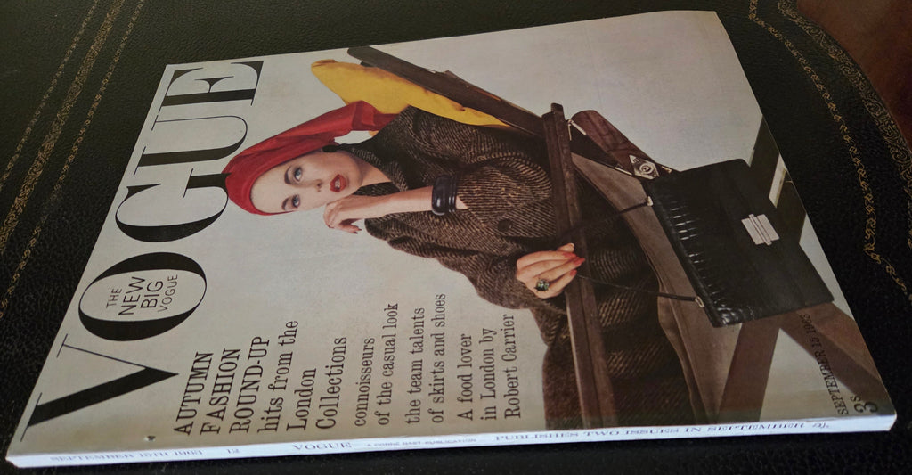 Vogue magazine cover with a woman in a red bandana lounging on a chair.