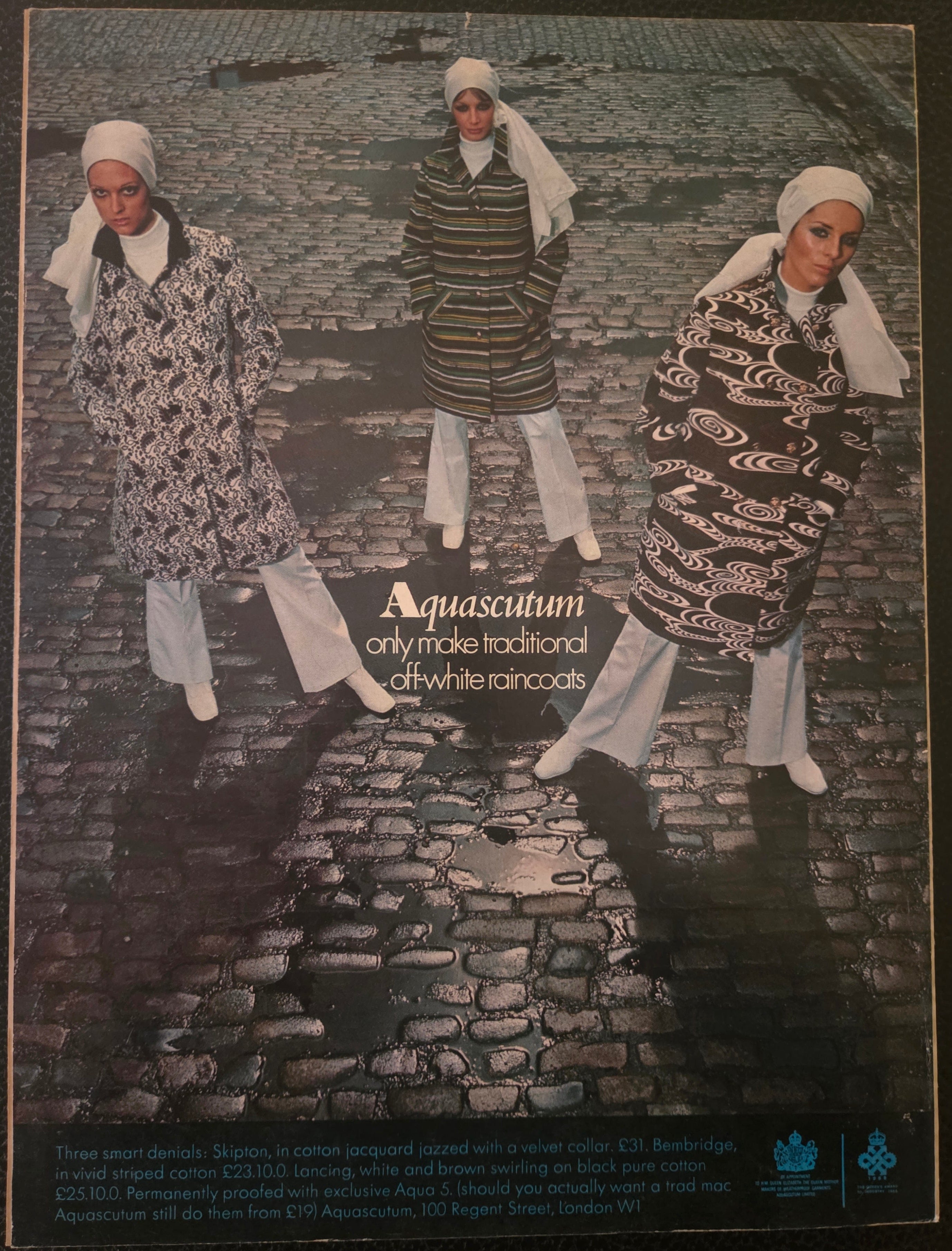 Vintage Aquascutum advert with 3 women on wet street.