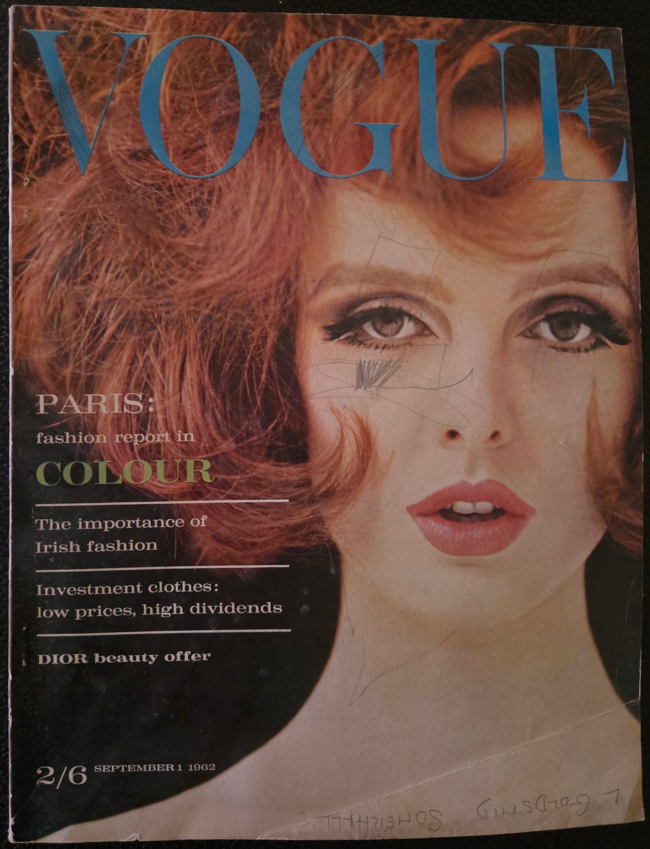 Vogue featuring model with red hair.
