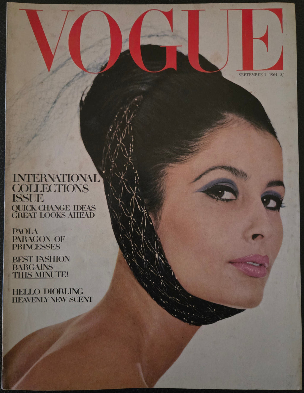 Vogue magazine with model wearing band around head.