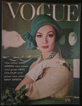 Vintage Vogue magazine cover with a model wearing a green headscarf and beige outfit.